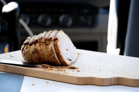 Sliced Bread on Cutting Board Inside Vehicle Stock Photos
