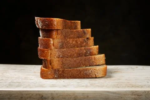 Sliced bread on a cutting board Stock Photos