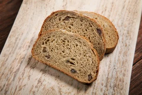 Sliced bread on a cutting board still-life Stock Photos