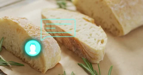 Sliced bread with digital chat icon animation over rosemary sprigs Stock Footage 305188839