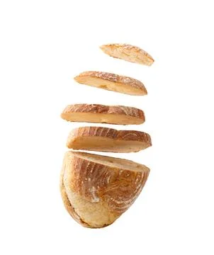 Sliced bread falls on a pile close-up on a white background. Isolated Stock Photos