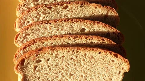 Sliced bread isolated on green plate background Stock Footage 188123246