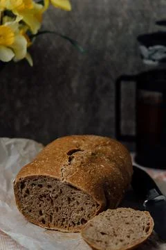 Sliced bread isolated on a white background. Bread slices and crumbs viewed f Stock Photos
