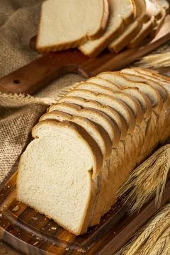 Sliced bread loaf on the table. Stock Photos