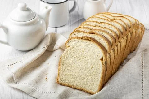 Sliced bread loaf on the table. Stock Photos