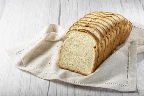 Sliced bread loaf on the table. Stock Photos