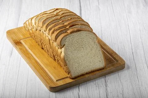 Sliced bread loaf on the table. Stock Photos