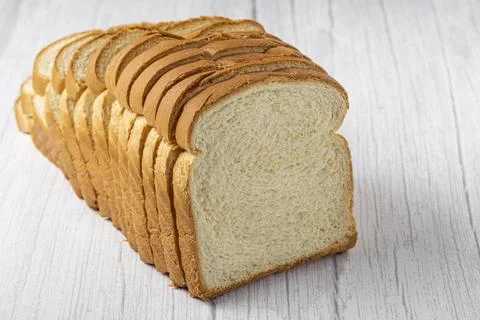 Sliced bread loaf on the table. Stock Photos