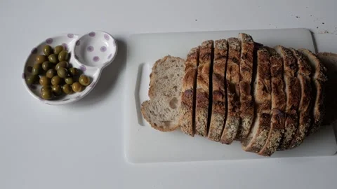 Sliced Bread with Olives: A Perfect Cozy Dining Complement Stock Footage 334580060