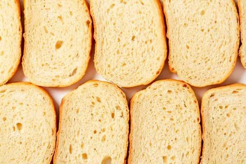 Sliced bread pieces on a clean surface 스톡 사진