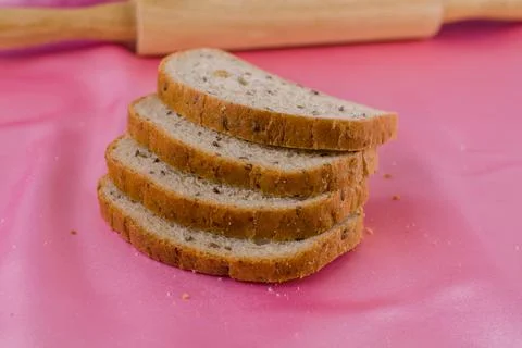 Sliced bread with a rolling pin on the cloth Stock Photos