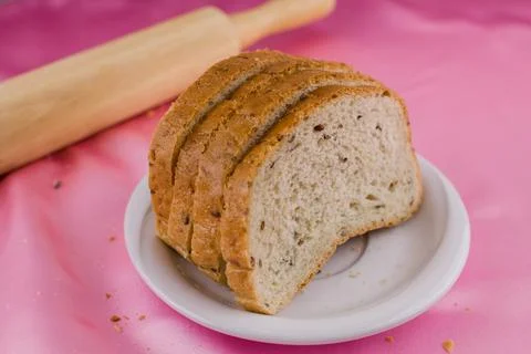Sliced bread with a rolling pin on the cloth Foto stock