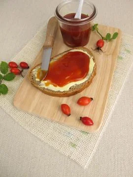 Sliced bread with rose hip jam for breakfast Stock Photos
