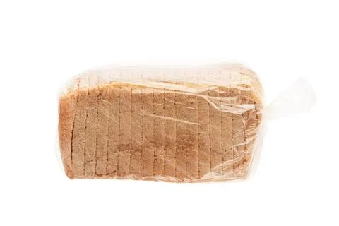 Sliced bread sits inside clear plastic packaging, showcasing its uniform slices Stock Photos