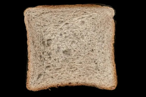 Sliced bread timelapse solid black background alpha matte Stock-Footage 38565752