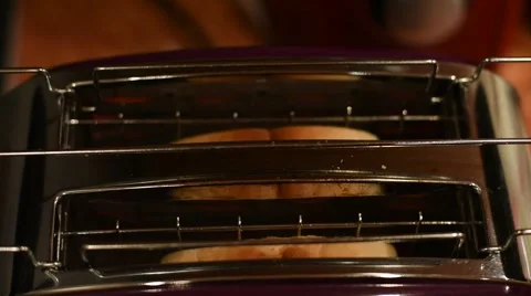 Sliced Bread Toasting in Electric Toaster Stock Footage 60033176