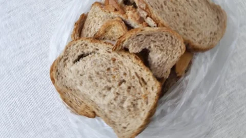 Sliced of bread turning Stock Footage 248616339