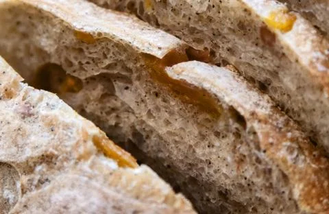 Sliced bread on a wooden table. Stock Photos