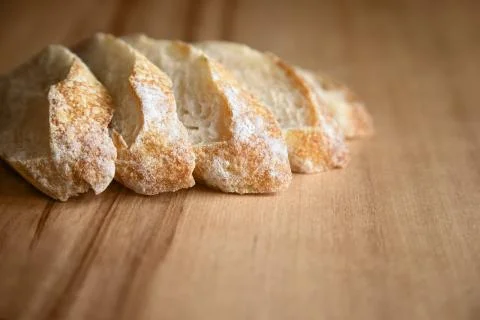 Sliced bread on a wooden table. Stock Photos