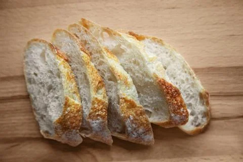 Sliced bread on a wooden table. Stock Photos