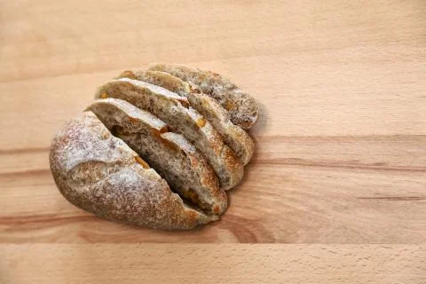Sliced bread on a wooden table. Stock Photos