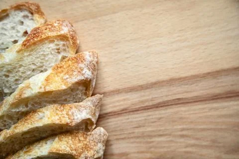 Sliced bread on a wooden table. Stock Photos