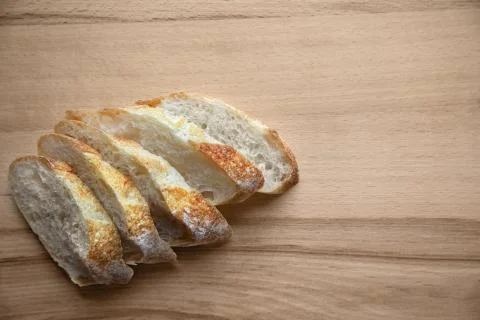 Sliced bread on a wooden table. Stock Photos