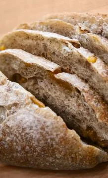 Sliced bread on a wooden table. Stock Photos