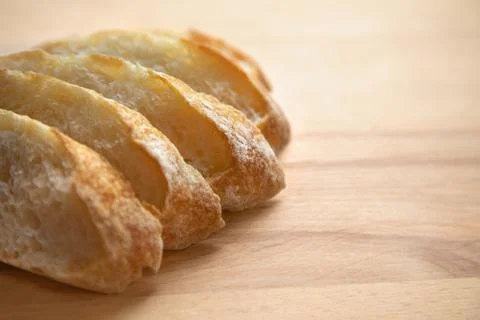 Sliced bread on a wooden table. Stock Photos