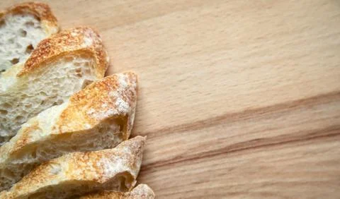 Sliced bread on a wooden table. Stock Photos