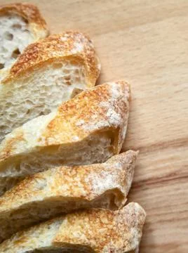 Sliced bread on a wooden table. Stock Photos