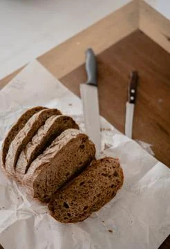 Sliced bread on wooden table Stock Photos