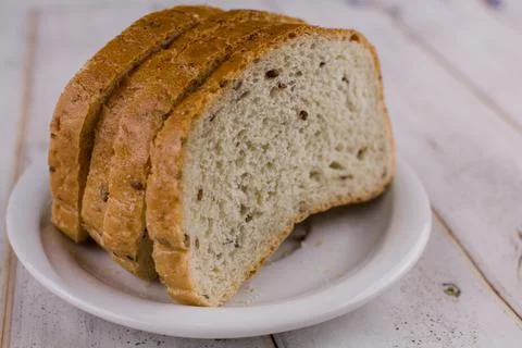 A sliced bread on a wooden table Stock Photos