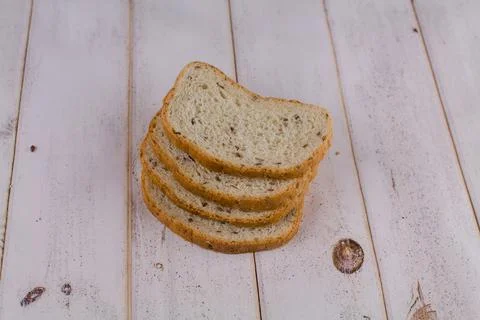 A sliced bread on a wooden table Stock Photos