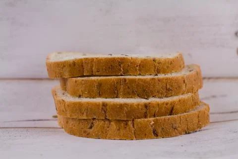 A sliced bread on a wooden table Stock Photos