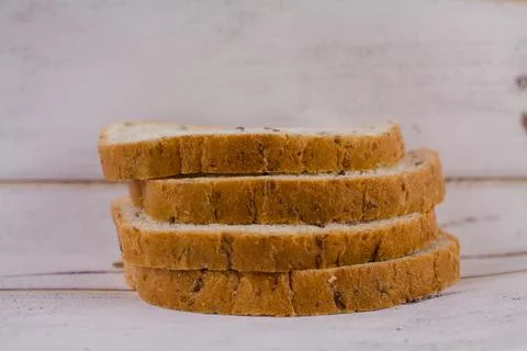 A sliced bread on a wooden table Stock Photos