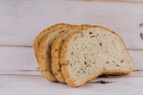 A sliced bread on a wooden table Stock Photos