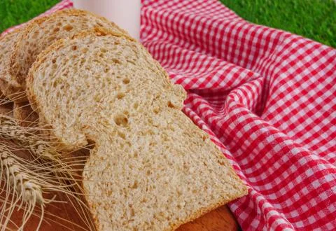 Sliced breads on grasses Stock Photos