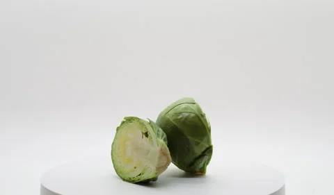 Sliced Brussels Sprout Rotating on Turntable Stock Footage 230740605