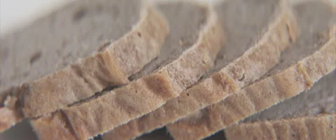 Sliced buckwheat bread close-up panning 4K video Stock Footage 323789747