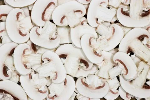 Sliced button mushrooms background Stock Photos