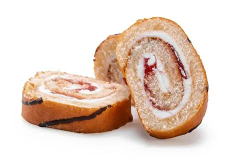 Sliced cake roll on white background Stock Photos