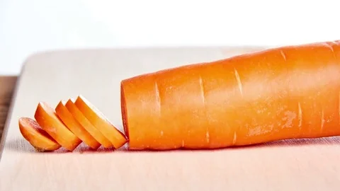 Sliced carrot on a kitchen board- stop motion animation and timelapse Stock Footage 69218170