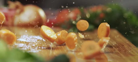 Sliced carrot pieces falling down Video stock 311834746