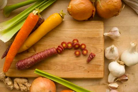 Sliced Carrots Surrounded by Vegetables Stock Photos