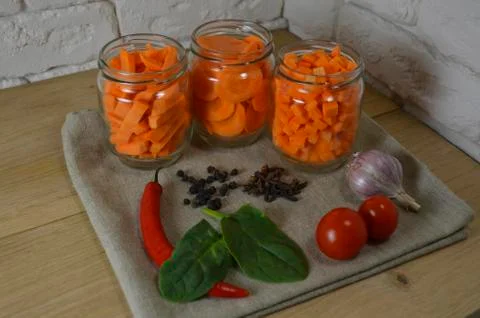 Sliced ​​carrots on a table in a jar Stock Photos