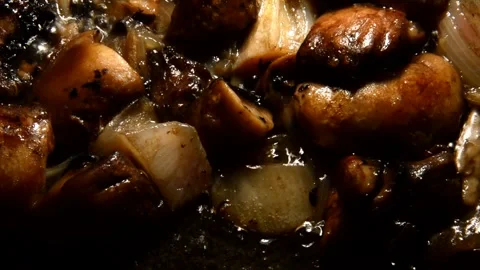 Sliced champignons with onion Stock Footage 321360604