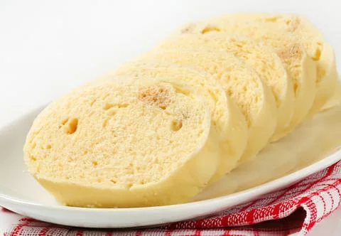 Sliced cheese bread on white plate Stock Photos