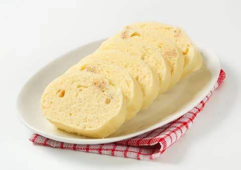 Sliced cheese bread on a white plate Stock Photos