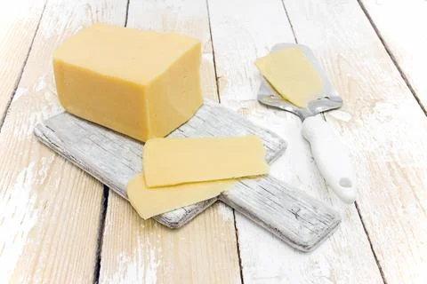 Sliced cheese on the table Stock Photos